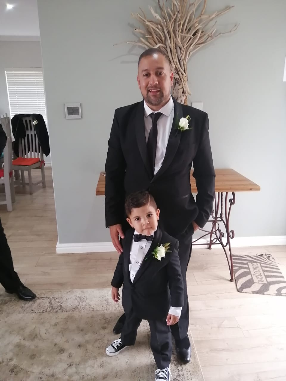 Jade Engel dressed formally with a young child
